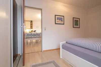 Ein Bett oder Betten in einem Zimmer der Unterkunft Familyhaus- Wohnung 8
