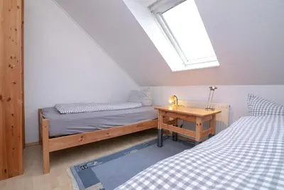 Ein Bett oder Betten in einem Zimmer der Unterkunft Familyhaus- Wohnung 8