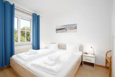 Ein Bett oder Betten in einem Zimmer der Unterkunft Seepark Muschelschubser