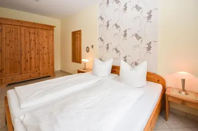 Ein Bett oder Betten in einem Zimmer der Unterkunft Seepark Störtebekers Nest