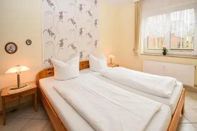 Ein Bett oder Betten in einem Zimmer der Unterkunft Seepark Störtebekers Nest