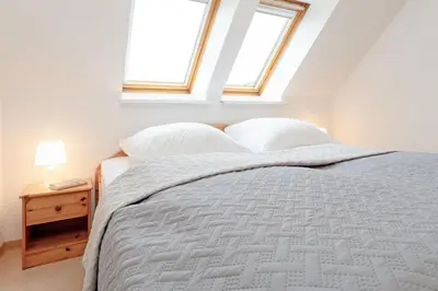Ein Bett oder Betten in einem Zimmer der Unterkunft Sperlingslust