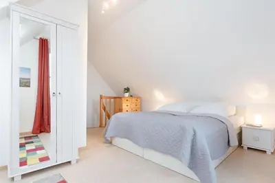 Ein Bett oder Betten in einem Zimmer der Unterkunft Sperlingslust
