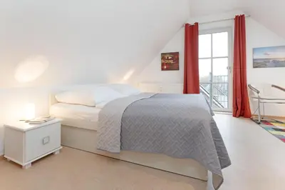 Ein Bett oder Betten in einem Zimmer der Unterkunft Sperlingslust