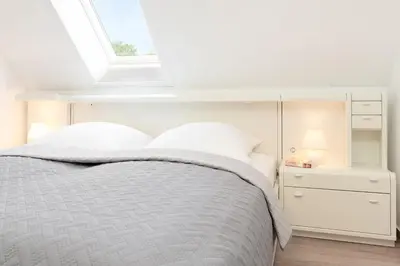 Ein Bett oder Betten in einem Zimmer der Unterkunft Kastanienallee 3
