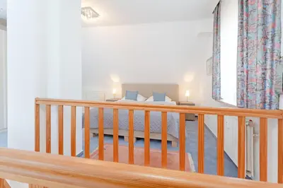 Ein Bett oder Betten in einem Zimmer der Unterkunft Kastanienallee 3