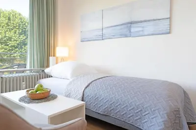 Ein Bett oder Betten in einem Zimmer der Unterkunft Haus Bellevue Möwensuite