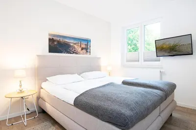 Ein Bett oder Betten in einem Zimmer der Unterkunft Gorch-Fock-Ring 19 Meerzeit II