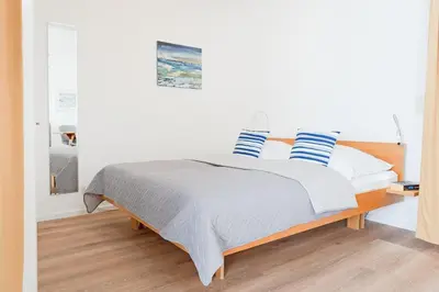 Ein Bett oder Betten in einem Zimmer der Unterkunft Hang 13 Meerblick 18