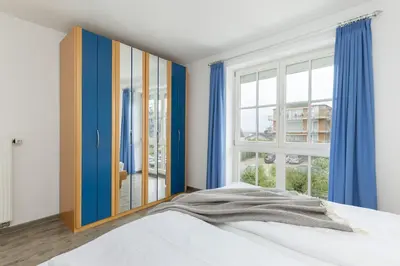 Ein Bett oder Betten in einem Zimmer der Unterkunft Hanseaten Residenz App 19
