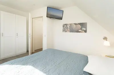 Ein Bett oder Betten in einem Zimmer der Unterkunft Badeweg 4 Bullerbü 10