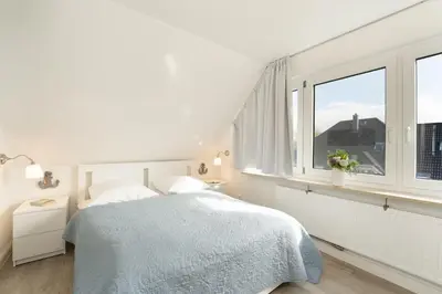 Ein Bett oder Betten in einem Zimmer der Unterkunft Badeweg 4 Bullerbü 10
