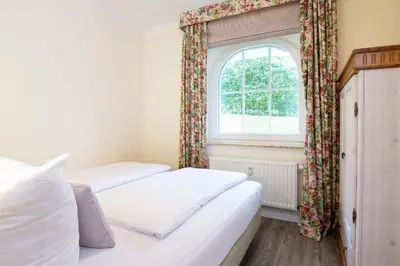 Ein Bett oder Betten in einem Zimmer der Unterkunft Haus Pegasus App 1