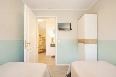 Ein Bett oder Betten in einem Zimmer der Unterkunft Haus Pegasus Küstenheimat