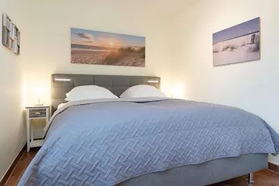 Ein Bett oder Betten in einem Zimmer der Unterkunft Appartement Meerzeit- Residenz Kurparkhöhe
