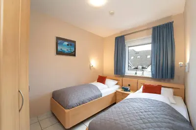 Ein Bett oder Betten in einem Zimmer der Unterkunft Badeweg 4 Strandläufer 2