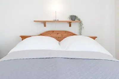 Ein Bett oder Betten in einem Zimmer der Unterkunft Fahrenkrug Westbrise