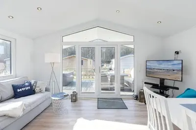 TV/Unterhaltungsangebot in der Unterkunft Ferienhäuser Lübecker Bucht Ferienhaus Beachcomber