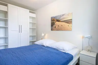Ein Bett oder Betten in einem Zimmer der Unterkunft Haus Beau Rivage Blaue Koje