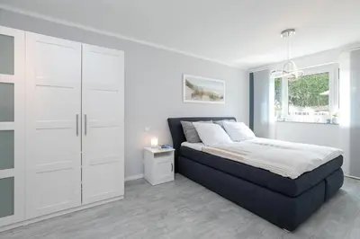 Ein Bett oder Betten in einem Zimmer der Unterkunft Passatstieg 1 Lüddn Traum