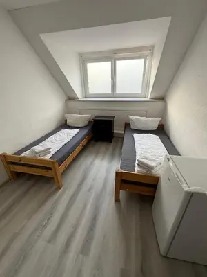 Ein Bett oder Betten in einem Zimmer der Unterkunft K 357 - Low budget Hotel in Ratekau bei Lübeck