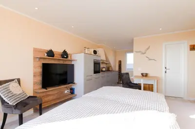 Ein Bett oder Betten in einem Zimmer der Unterkunft Ferienwohnung Aalkate App 3