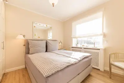 Ein Bett oder Betten in einem Zimmer der Unterkunft Ferienwohnung Meeresleuchten