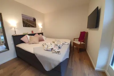Ein Bett oder Betten in einem Zimmer der Unterkunft Neue Liebe Haffkrug 1