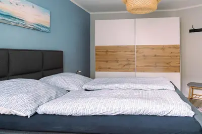 Ein Bett oder Betten in einem Zimmer der Unterkunft Fewo Seebrücke
