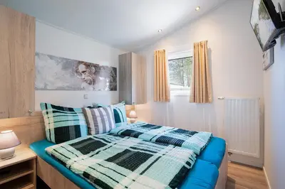 Ein Bett oder Betten in einem Zimmer der Unterkunft Casa del Mar Scharbeutz - Sauna kostenlos - 1 kleiner Hund willkommen - umzäunter Garten
