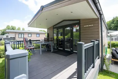 Ein Balkon oder eine Terrasse in der Unterkunft Casa del Sol Scharbeutz - Sauna kostenlos - 1 kleiner Hund willkommen - umzäunter Garten