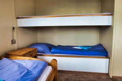 Ein Bett oder Betten in einem Zimmer der Unterkunft Finnenhaus 1