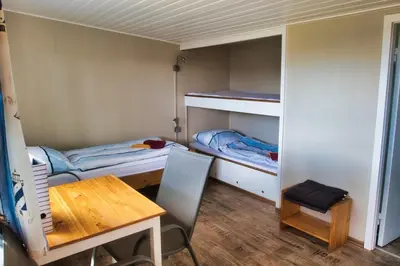 Ein Bett oder Betten in einem Zimmer der Unterkunft Finnenhaus 6