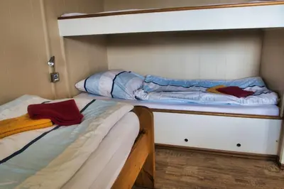 Ein Bett oder Betten in einem Zimmer der Unterkunft Finnenhaus 6