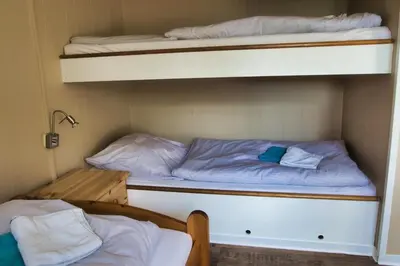 Ein Bett oder Betten in einem Zimmer der Unterkunft Finnenhaus 9
