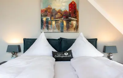 Ein Bett oder Betten in einem Zimmer der Unterkunft Ferienwohnung Strandburg 25