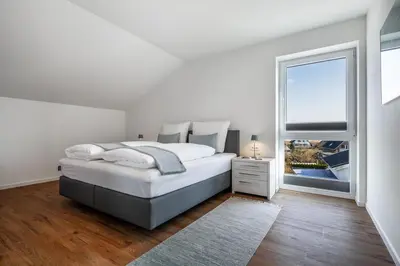 Ein Bett oder Betten in einem Zimmer der Unterkunft Casa Báltica Haffkrug