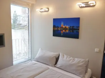 Ein Bett oder Betten in einem Zimmer der Unterkunft Hotel Am Mühlenteich