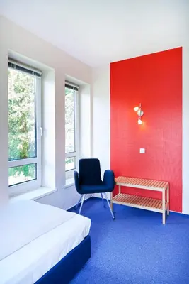 Ein Bett oder Betten in einem Zimmer der Unterkunft Hotel Am Mühlenteich