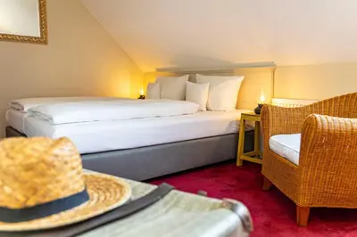 Ein Bett oder Betten in einem Zimmer der Unterkunft Romantik Hotel Friederikenhof Hotel Restaurant & Spa