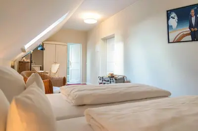Ein Bett oder Betten in einem Zimmer der Unterkunft Romantik Hotel Friederikenhof Hotel Restaurant & Spa