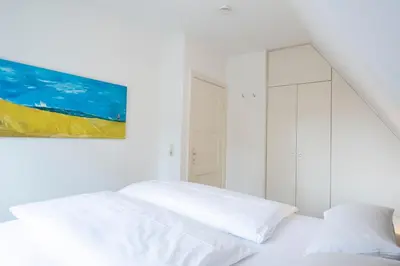 Ein Bett oder Betten in einem Zimmer der Unterkunft Ferienhaus am Strandwäldchen