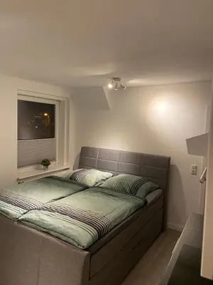 Ein Bett oder Betten in einem Zimmer der Unterkunft Ferienwohnungen Dummersdorfer Straße