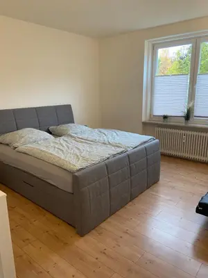 Ein Bett oder Betten in einem Zimmer der Unterkunft Ferienwohnungen Dummersdorfer Straße