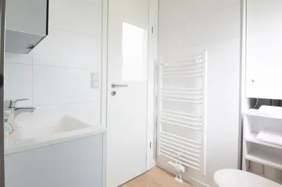 Ein Badezimmer in der Unterkunft Ferienhäuser Lübecker Bucht Aquamarin