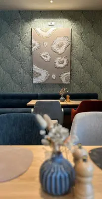 Ein Sitzbereich in der Unterkunft Country Hotel Timmendorfer Strand