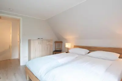Ein Bett oder Betten in einem Zimmer der Unterkunft Haus Sonnenberg
