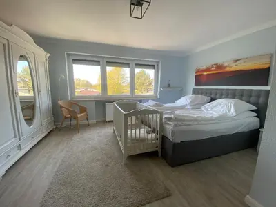 Ein Bett oder Betten in einem Zimmer der Unterkunft Casa Raphael direkt am Scharbeutzer Strand