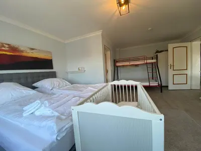 Ein Bett oder Betten in einem Zimmer der Unterkunft Casa Raphael direkt am Scharbeutzer Strand