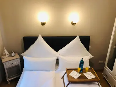 Ein Bett oder Betten in einem Zimmer der Unterkunft Ferienwohnung B im Ferienhaus Antika
